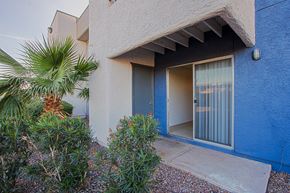 Phoenix apartment for rent - a blue and white building with a glass door