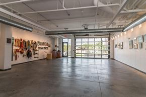 Hastings apartment for rent - a large room with paintings on the wall and a door