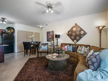 Jonesboro apartment for rent - a living room with a couch and a dining room table