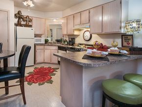 Jonesboro apartment for rent - a kitchen with a breakfast bar and a table with chairs