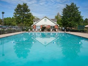 Jonesboro apartment for rent - a swimming pool with a house in the background