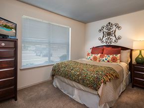 Harrison apartment for rent - a bedroom with a bed and a large window