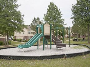 Springdale apartment for rent - a playground with a slide and a chair in a park