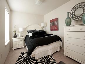 Springdale apartment for rent - a bedroom with a bed and a dresser