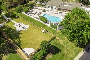 Nashville apartment for rent - a backyard with a pool and a yard with lawn furniture and a house