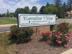 Saginaw apartment for rent - a sign on the side of a road in front of some flowers