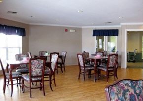 Flushing townhouse for rent - a dining room with a table and chairs in it
