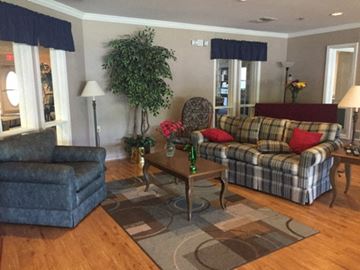 Flushing townhouse for rent - a living room with a couch and a chair and a table