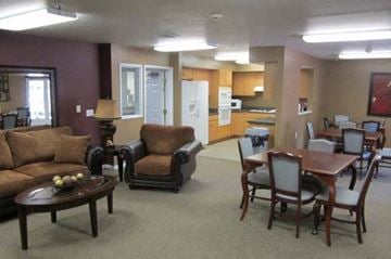 Flint townhouse for rent - a living room and kitchen with a table and chairs