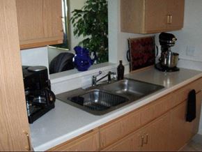 Flint townhouse for rent - a kitchen counter with a sink and a window