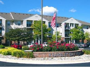 Flint townhouse for rent - an flag in front of an apartment building