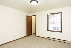 Holland apartment for rent - a bedroom with a window and a door to a closet
