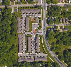 Flint townhouse for rent - an aerial view of the parking lot of a city street