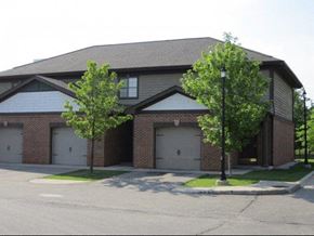 Flint townhouse for rent - a brick house with two garage doors