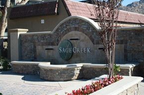 Simi Valley apartment for rent - A stone wall with Sage Creek written on it.