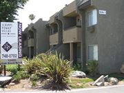 Poway apartment for rent - A sign for Scripps Poway Villas is in front of a building.