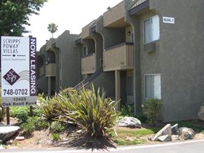 Poway apartment for rent - A sign for Scripps Poway Villas is in front of a building.