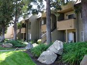 Poway apartment for rent - Apartment complex with greenery in front.