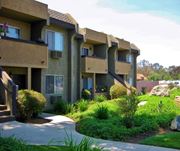 Poway apartment for rent - Apartment complex with greenery in front.