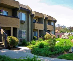 Poway apartment for rent - Apartment complex with greenery in front.