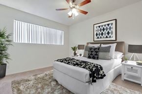 Los Angeles apartment for rent - a bedroom with a bed and a ceiling fan