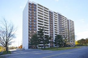 Toronto apartment for rent - A tall residential building with many windows and balconies.