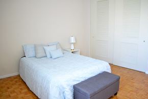 Toronto apartment for rent - a bedroom with a large bed and a