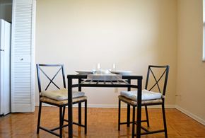 Toronto apartment for rent - a dining room with a table and three chairs