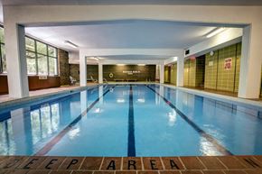 Toronto apartment for rent - a swimming pool in a building with a large window