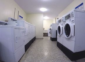 Toronto apartment for rent - a laundry room filled with washers and dryers