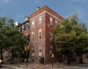Philadelphia apartment for rent - a red brick building on the corner of a city street