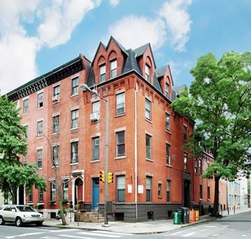 Philadelphia apartment for rent - a red brick building on the corner of a city street