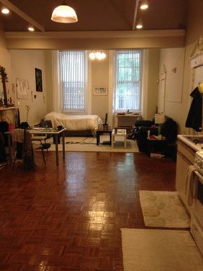 Philadelphia apartment for rent - a living room with a bed and a kitchen