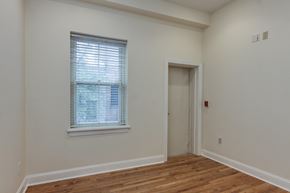 Philadelphia apartment for rent - a bedroom with white walls and a window and a door