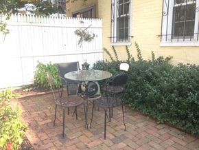 Philadelphia apartment for rent - a patio with a table and chairs on a brick patio