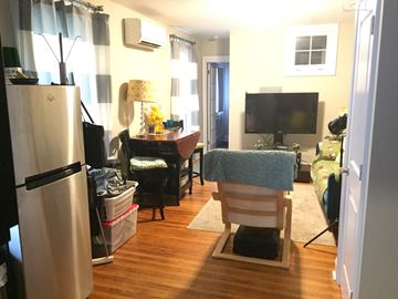 Philadelphia apartment for rent - a living room filled with furniture and a tv