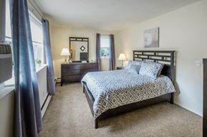 S. Weymouth apartment for rent - a bedroom with a bed and a dresser and a window