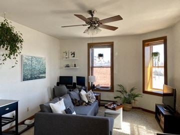 Madison apartment for rent - a living room with a couch and a ceiling fan