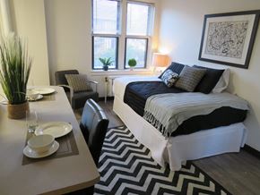 Madison apartment for rent - an example of a bedroom with a bed and a dining table