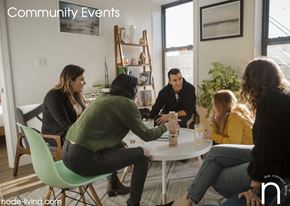 Brooklyn apartment for rent - A group of people are sitting around a table in a room.