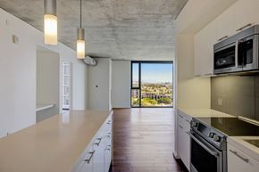 West Hollywood apartment for rent - a kitchen with a large island and a view of the city