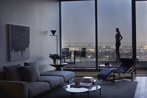 West Hollywood apartment for rent - a living room with a view of the city and a couch and chair