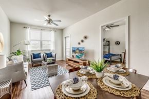 Fort Worth apartment for rent - A dining room with a table set for a meal.