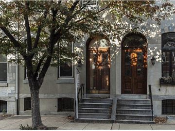 Philadelphia apartment for rent - a building with steps and a tree in front of it