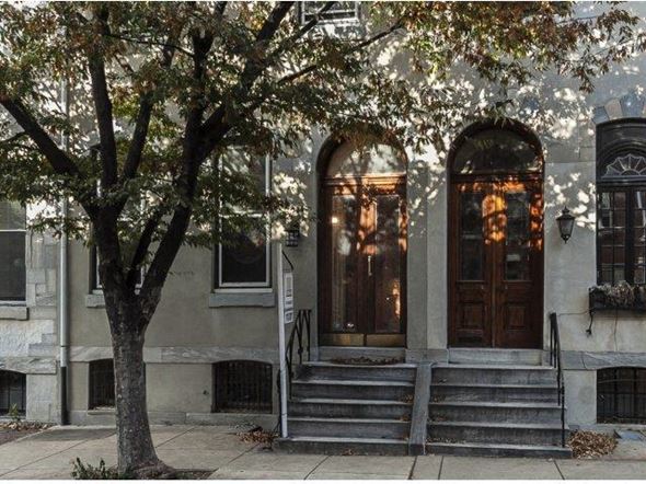 Philadelphia apartment for rent - a building with steps and a tree in front of it