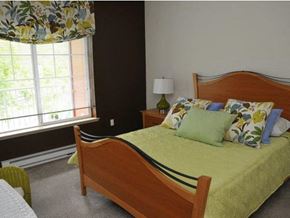 Portland apartment for rent - a bedroom with a bed and a window