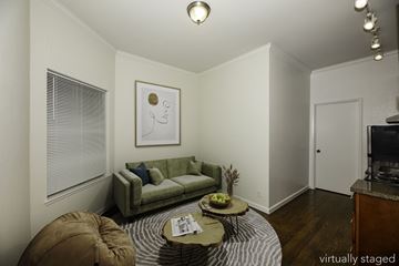 San Francisco apartment for rent - A living room with a green couch and a coffee table.