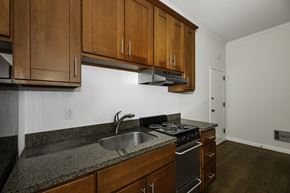 San Francisco apartment for rent - A kitchen with a stove, sink and cabinets.