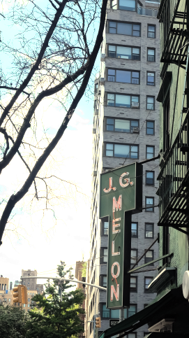 New York apartment for rent - a sign for a restaurant on the side of a building