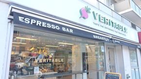 New York apartment for rent - the front of a store called espressos bar with a sign in the window